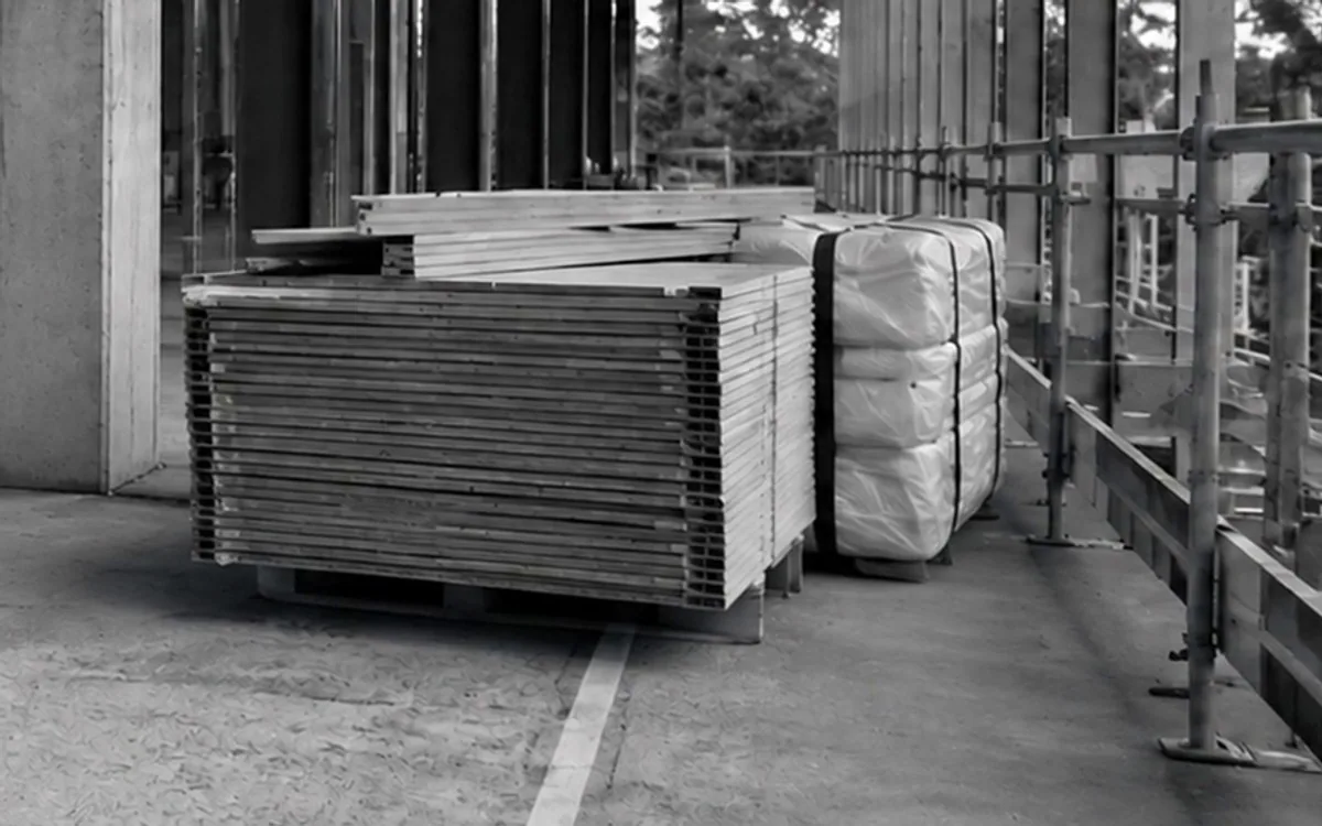 Illustrative construction site: boards and packaging obstruct the access route in Area C.